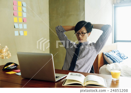 A man working on a computer 24851208