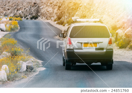 SUV driving on the rock mountain road in Leh,India SUV driving on the rock mountain road in Leh,India 24851760