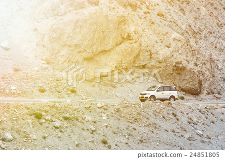 SUV driving on the rock mountain road in Leh,India SUV driving on the rock mountain road in Leh,India 24851805