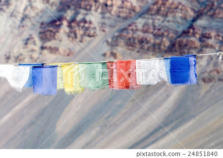 Colorful prayer flags with sun shining 24851840