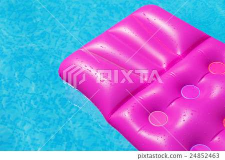 Pink air mattress on a swimming pool Pink air mattress on a swimming pool 24852463