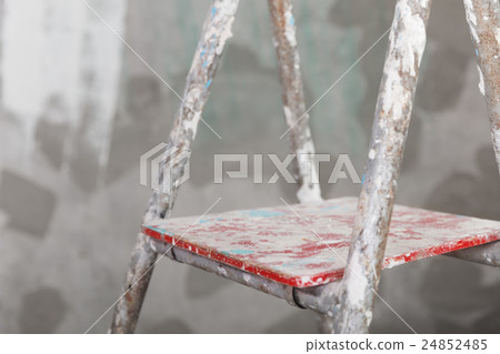 Old painted and stucco ladder on concrete wall 24852485