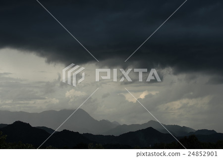 Storm and big black cloud over mountain. 24852901