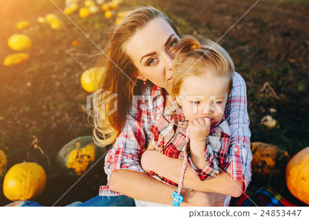 mother playing with her daughter 24853447