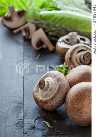Fresh portobello on wooden background Fresh portobello on wooden background 24853948