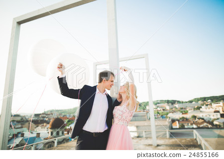 Loving couple on the background of the setting sun Loving couple on the background of the setting sun 24855166
