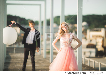 Lovers man and woman embracing each other outdoors 24855174