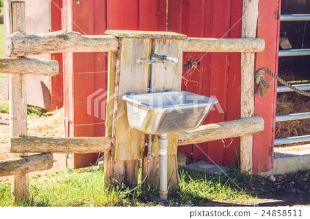 Steel sink outside a barn Steel sink outside a barn 24858511