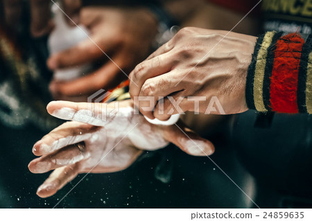 closeup of male hands with sports wristbands 24859635