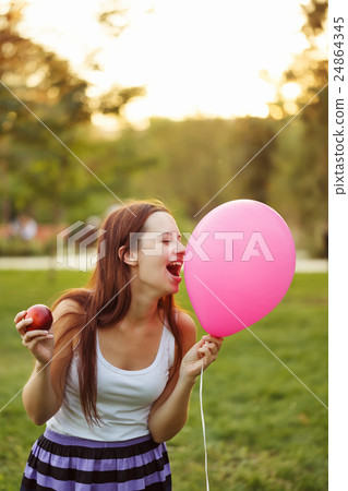 Girl, an apple and a balloon Girl, an apple and a balloon 24864345