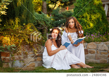 Two sisters and books 24864346