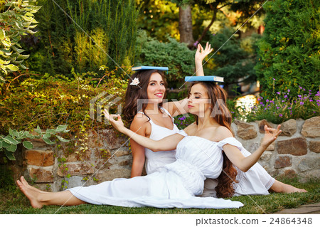 Sisters fooled with books 24864348