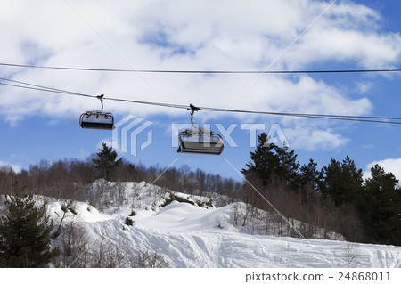 Chair-lift and off-piste slope in ski resort 24868011