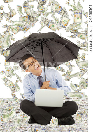 business man sitting on floor with us dollar rain 24868361
