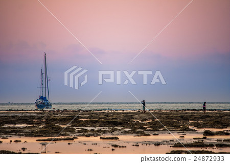 sunset on the beach boat stop at distance of beach sunset on the beach boat stop at distance of beach 24872933
