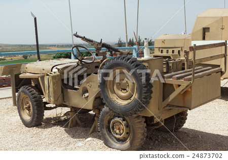 old army vehicle with a machine gun 24873702