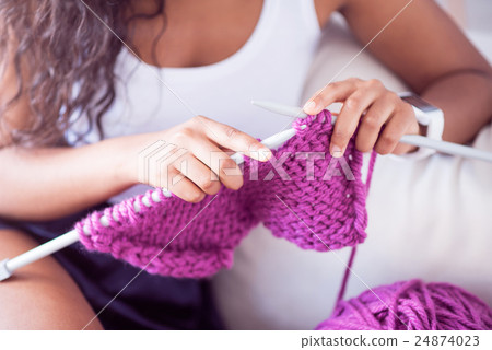 Pleasant woman knitting at home Pleasant woman knitting at home 24874023