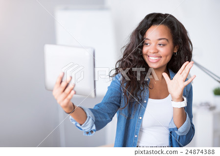 Positive woman using tablet Positive woman using tablet 24874388