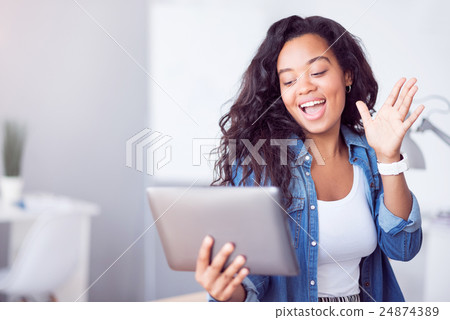 Cheerful woman using tablet Cheerful woman using tablet 24874389