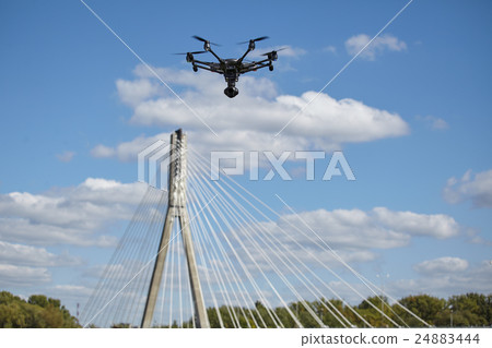 Copter flight against blue sky. RC aerial drone. Copter flight against blue sky. RC aerial drone. 24883444