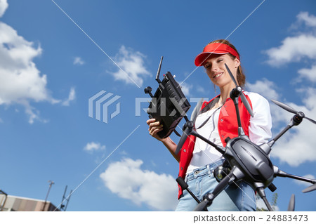 A woman and drone, Hobby concept 24883473