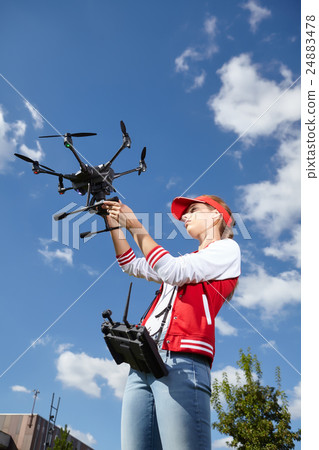 A woman and drone, Hobby concept A woman and drone, Hobby concept 24883478
