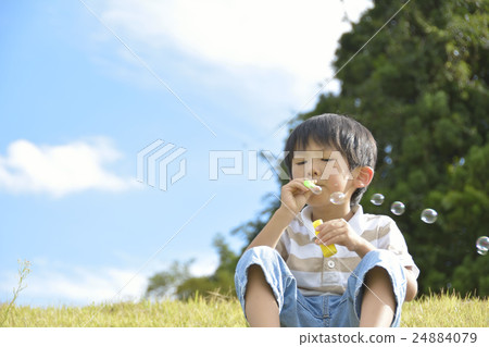 Boys playing with Shabon ball Boys playing with Shabon ball 24884079