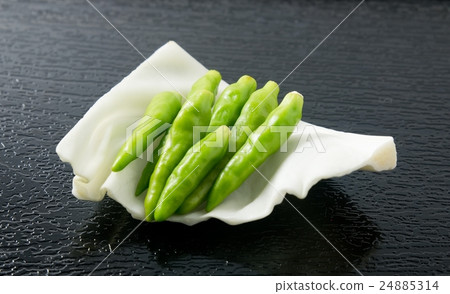 Fresh Green Chili Pepper on Cabbage Leaf 24885314