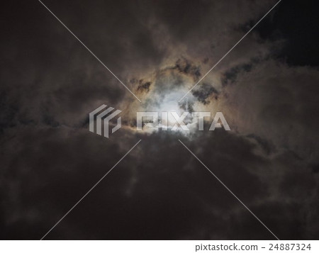Moon in dark cloudy night sky Moon in dark cloudy night sky 24887324