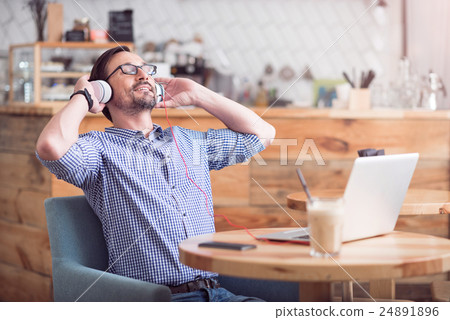 Attractive man relaxing in the cafe 24891896