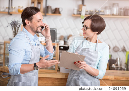 Cheerful workers communicating in cafe 24891969