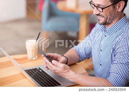 Handsome man using wearable technologies Handsome man using wearable technologies 24892004