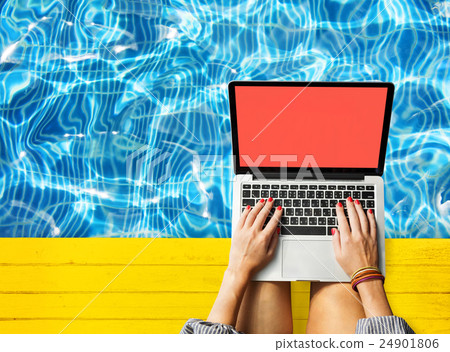 Female Hands Typing Macbook Poolside Concept Female Hands Typing Macbook Poolside Concept 24901806