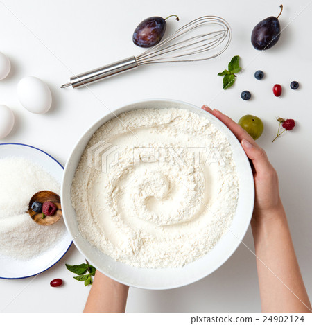 cook hands holding the flour in plate cook hands holding the flour in plate 24902124