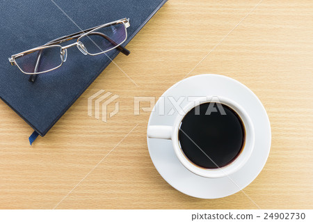 Coffee cup on wood deck and glasses Coffee cup on wood deck and glasses 24902730
