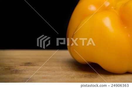 close up on yellow paprika  on wood 24906363