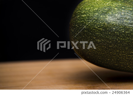close up on Zucchini courgette on wood  24906364