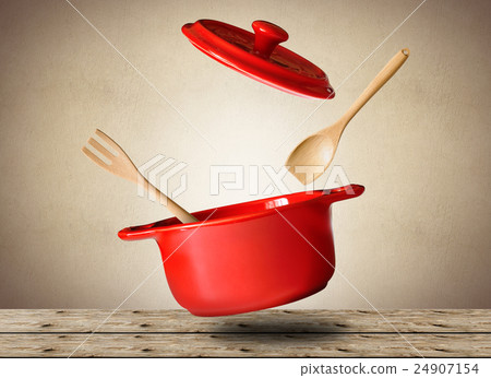 Big red pot for soup with spoon and fork Big red pot for soup with spoon and fork 24907154