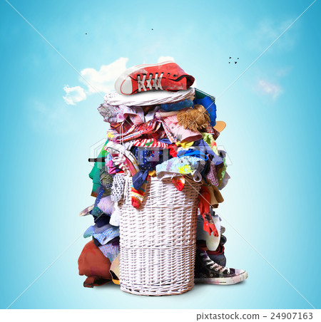 White straw basket full of dirty Laundry White straw basket full of dirty Laundry 24907163