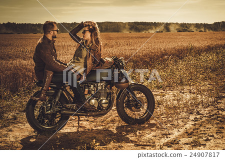 Stylish cafe racer couple on the vintage custom 24907817