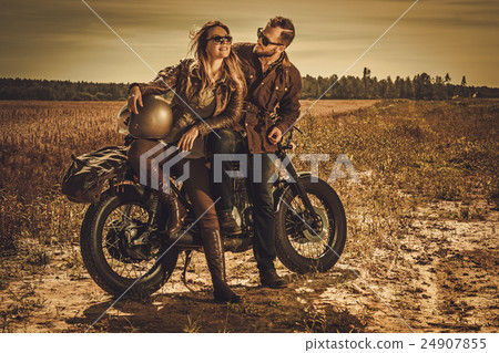 Stylish cafe racer couple on the vintage custom 24907855