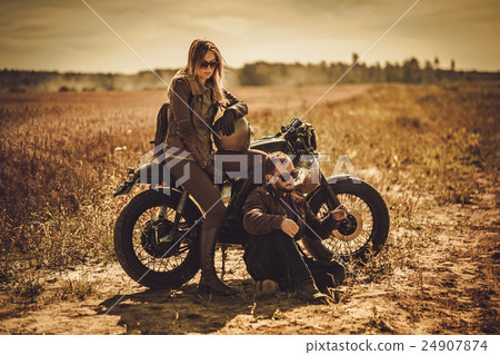 Stylish cafe racer couple on the vintage custom 24907874