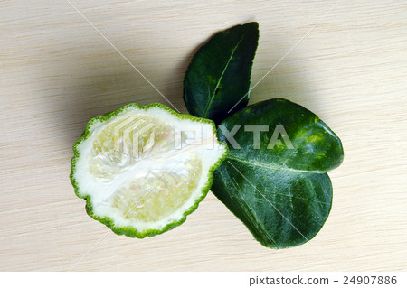 Bergamot fruit with leaf on wooden board 24907886
