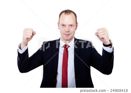 Successful businessman raising arms at workplace 24908418