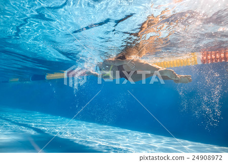 Swimmer in sidestroke style underwater Swimmer in sidestroke style underwater 24908972