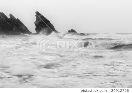 Black and white photo of Atlantic ocean rocky coastline Black and white photo of Atlantic ocean rocky coastline 24912766