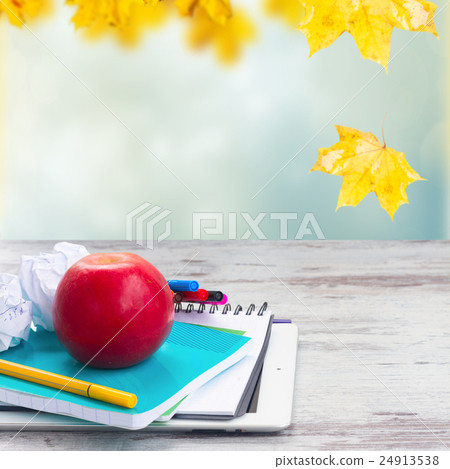 Apple with school supplies Apple with school supplies 24913538