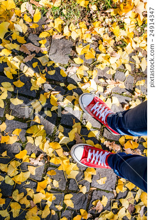 Legs of unrecognizable person in winter boots Legs of unrecognizable person in winter boots 24914347