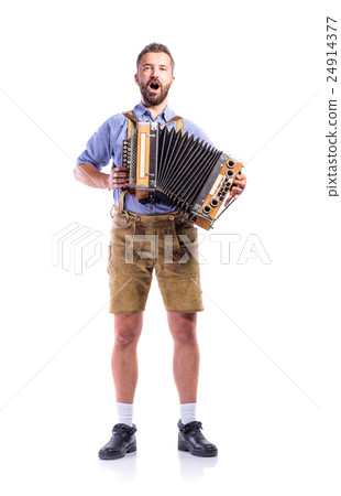 Man in bavarian clothes playing accordion and Man in bavarian clothes playing accordion and 24914377