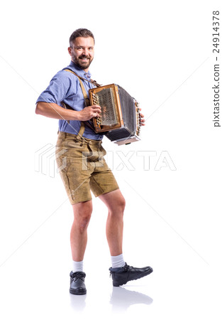 Man in traditional bavarian clothes playing Man in traditional bavarian clothes playing 24914378